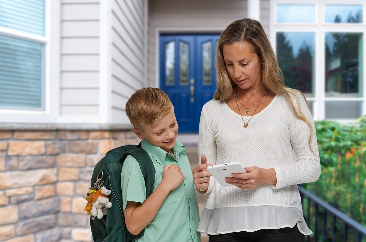 Mother with child in school uniform